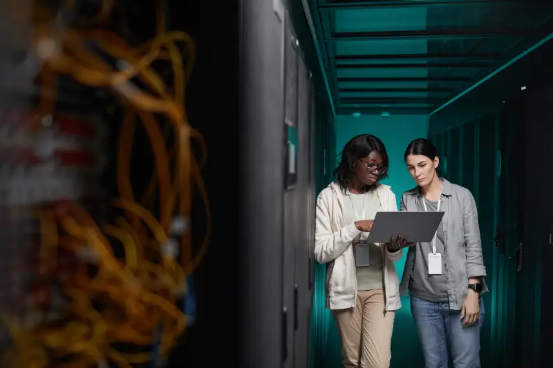 Engineers managing servers in a data center